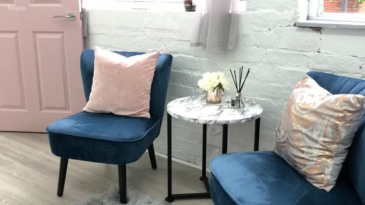 Cosy waiting area with velvet seating at the Skin by Emma studio